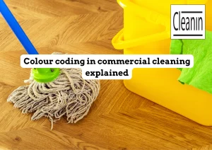 cleanin staff using colour coded bucket mop